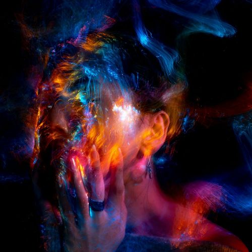 A person's feet in motion on a wooden floor, blurred effect.