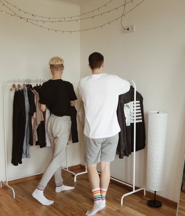 Person in comfortable clothes moving freely in a minimalist sunlit room.
